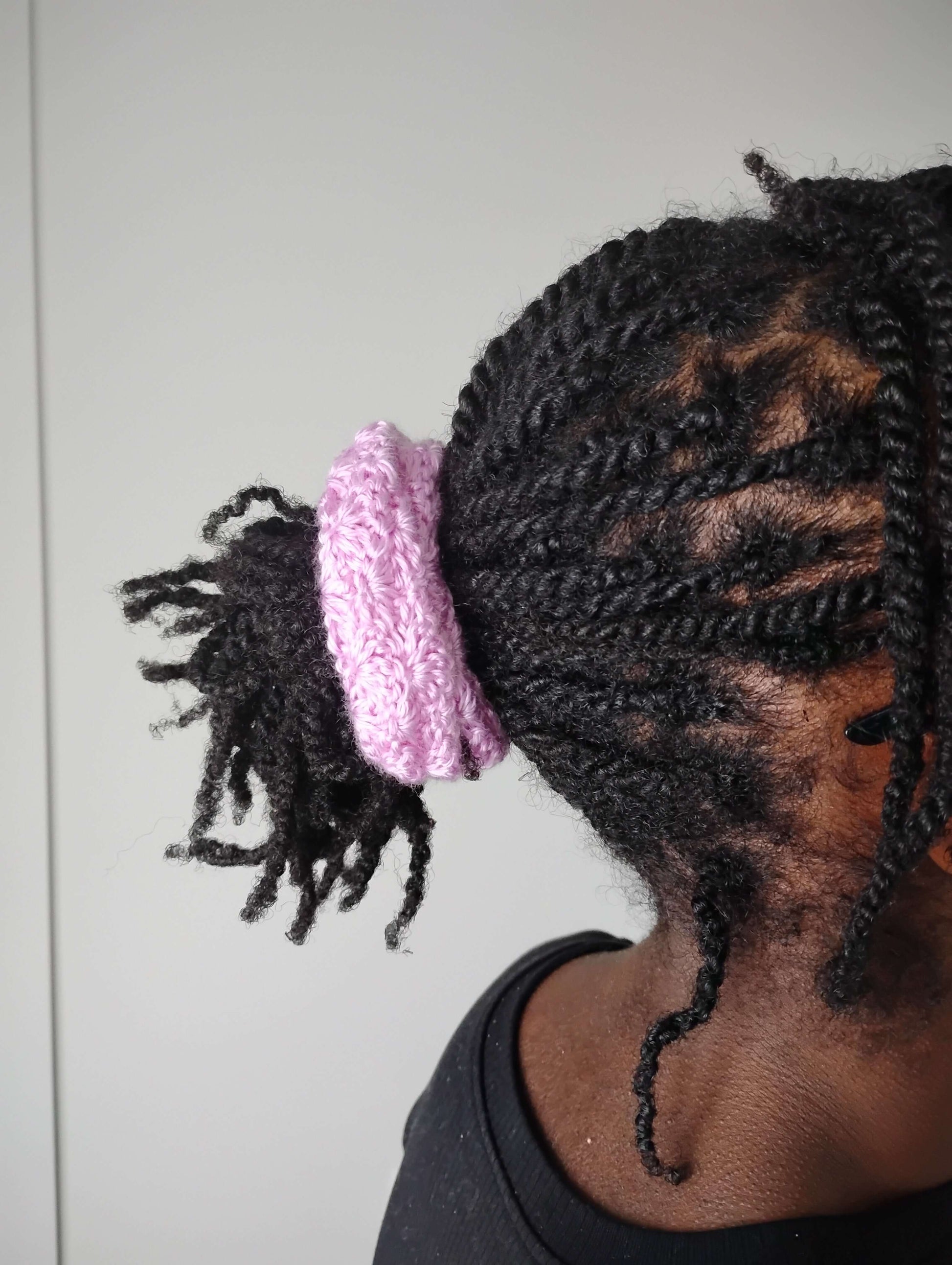 Hair ties soft handmade crochet in a ponytail, showcasing a light acrylic scrunchie on braided hair.