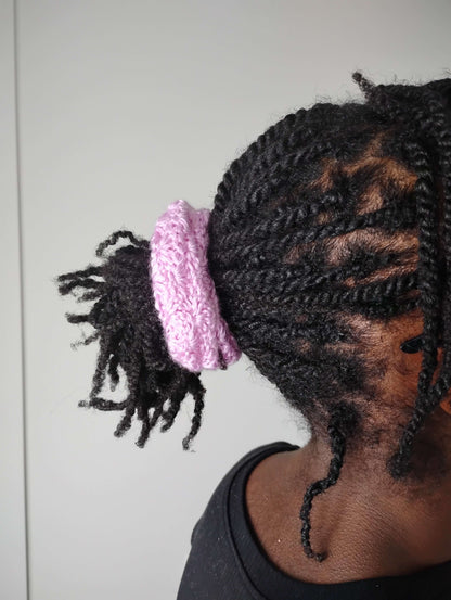 Hair ties soft handmade crochet in a ponytail, showcasing a light acrylic scrunchie on braided hair.