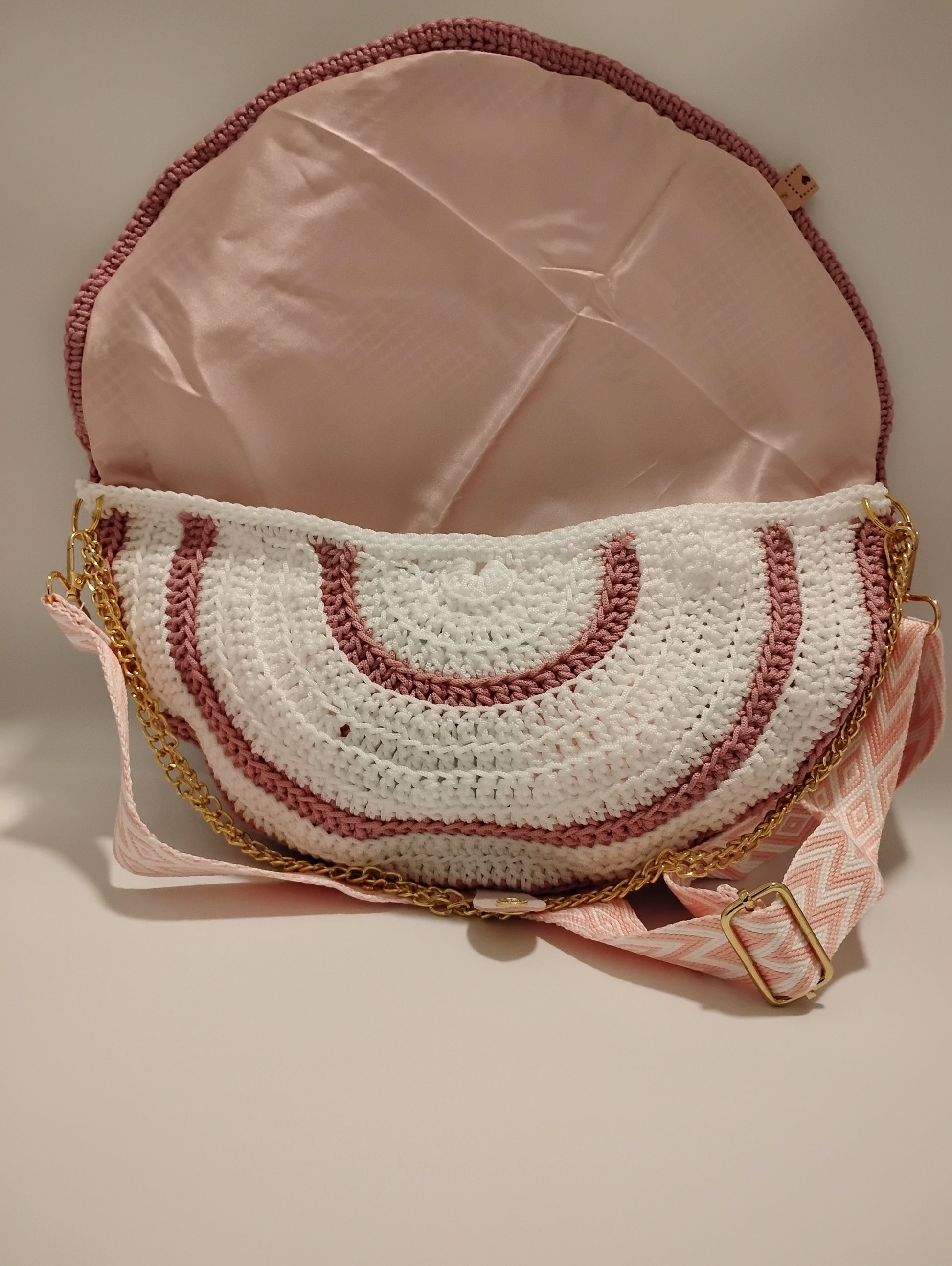 Mid Moon crossbody bag two-tone showing unique crochet design and attractive interior.
